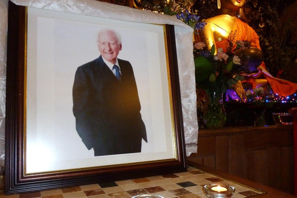 A portrait of Robert Ford stands in a Buddhist temple in London during a special remembrance prayer service. Photo: Peter Simpson
