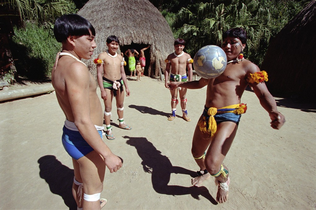 Xingu tribes people in the Amazon rainforest play football. Photo: SMP