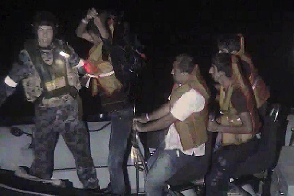 Australian Navy assist rescued asylum-seekers. Photo: AFP