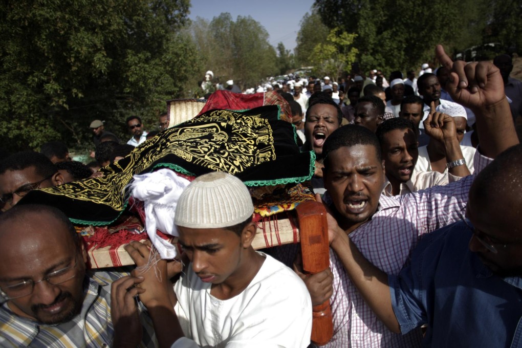 The funeral of Salah Mudahir Sanhuri, 26, who was killed by security forces. The protests have prompted calls to scrap austerity measures which sparked the unrest. Photo: AP
