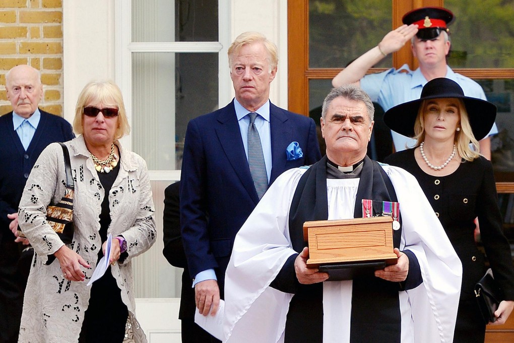 The ashes are carried to their final resting place. Photo: AFP