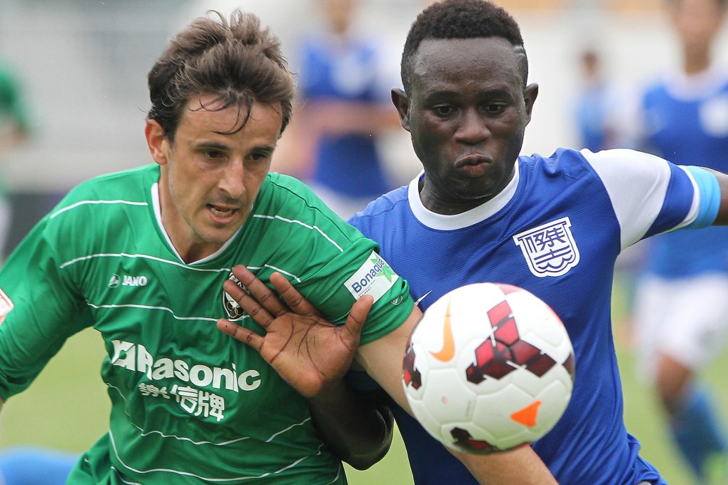 Citizen's Helio Jose Goncalves and Kitchee's Alexander Akande, who scored two goals, battle for the ball yesterday. Photo: K.Y. Cheng