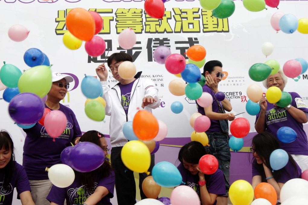 Secretary for Food and Health Dr Ko Wing-man (third left) and actress Carina Lau (fifth left) at the charity walk. Photo: David Wong