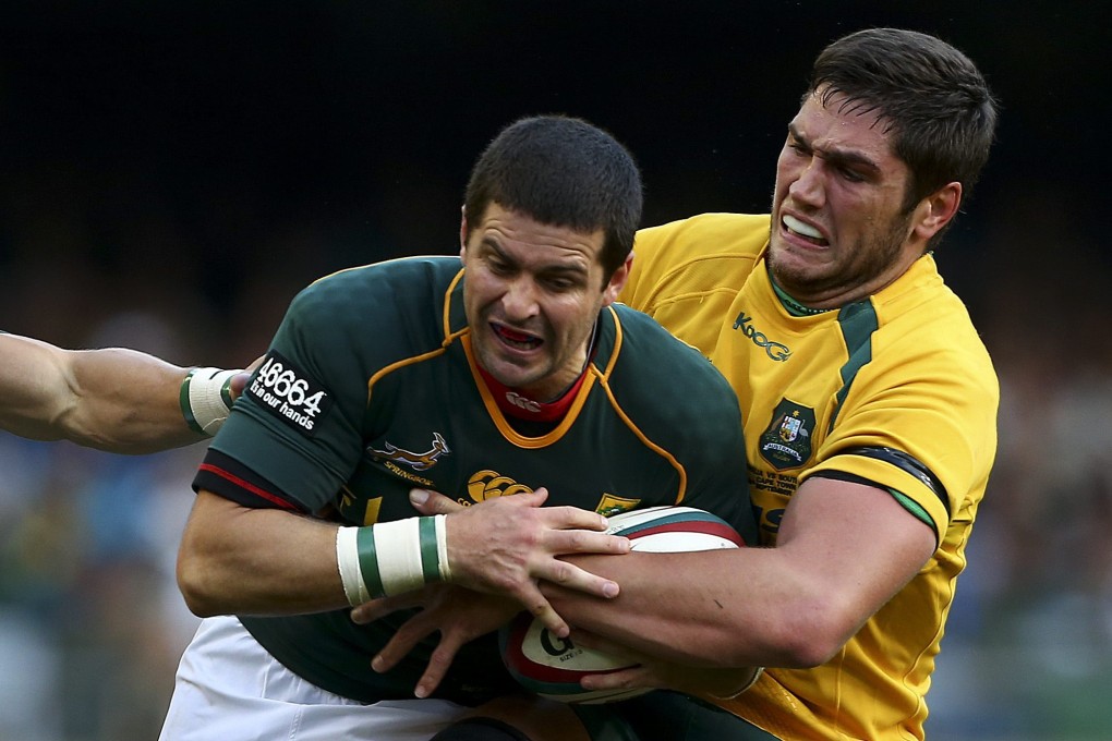 Morne Steyn of South Africa is tackled by Australia's Robs Simmons during their Rugby Championship match. Photo: EPA