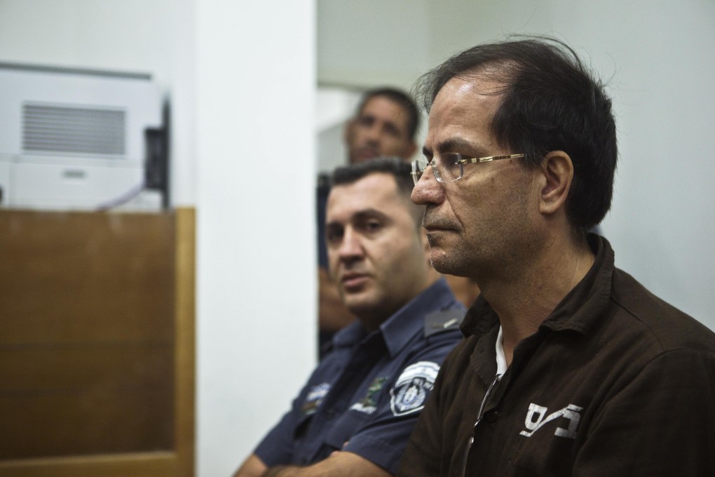 Iranian-Belgian citizen Ali Mansouri sits in a courtroom at court in Petah Tikva. Photo: Reuters
