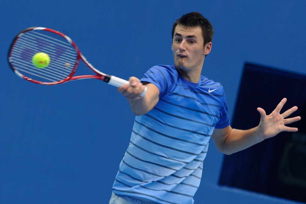 Bernard Tomic hits a return to Zhang Ze in the second round of the China Open in Beijing. Photo: AFP