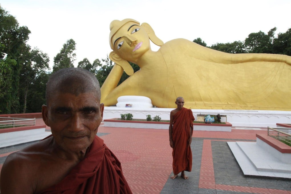 A new Buddha figure graces a rebuilt temple at Ramu. More than 50 idols were imported from Myanmar and Thailand. Photo: Xinhua