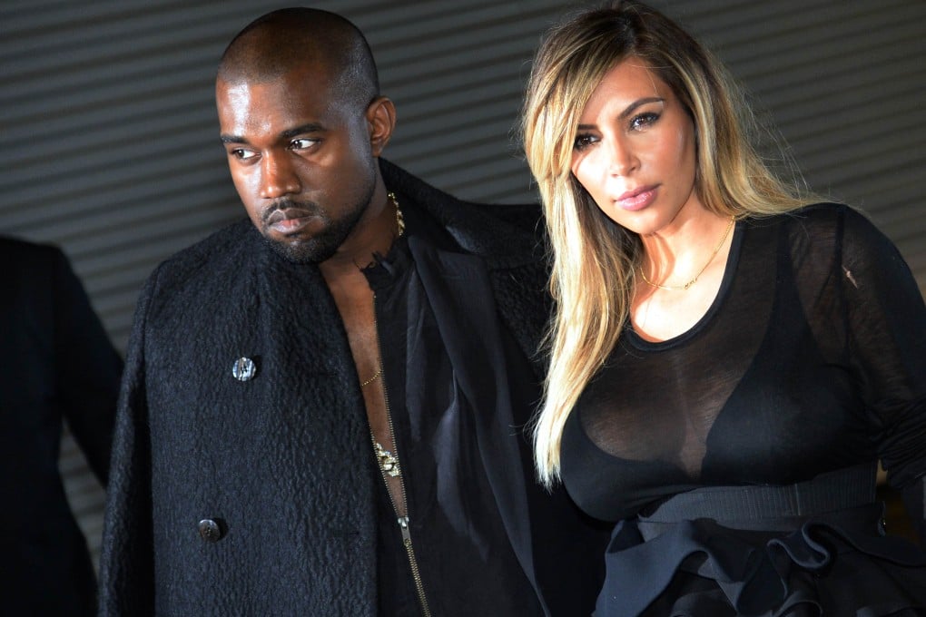 US musician Kanye West and companion Kim Kardashian pose prior to Givenchy 2014 Spring/Summer ready-to-wear collection fashion show, on September 29, 2013 in Paris. Photo: AFP