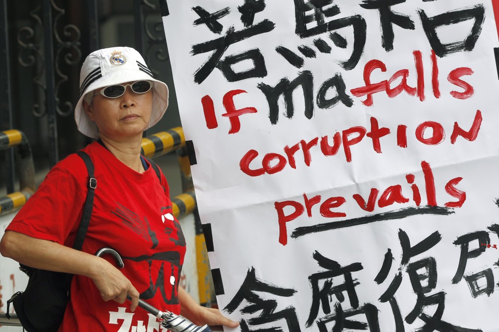 Supporters of President Ma denounce Wang Jin-pyng outside Taiwan's legislature. Photo: AP
