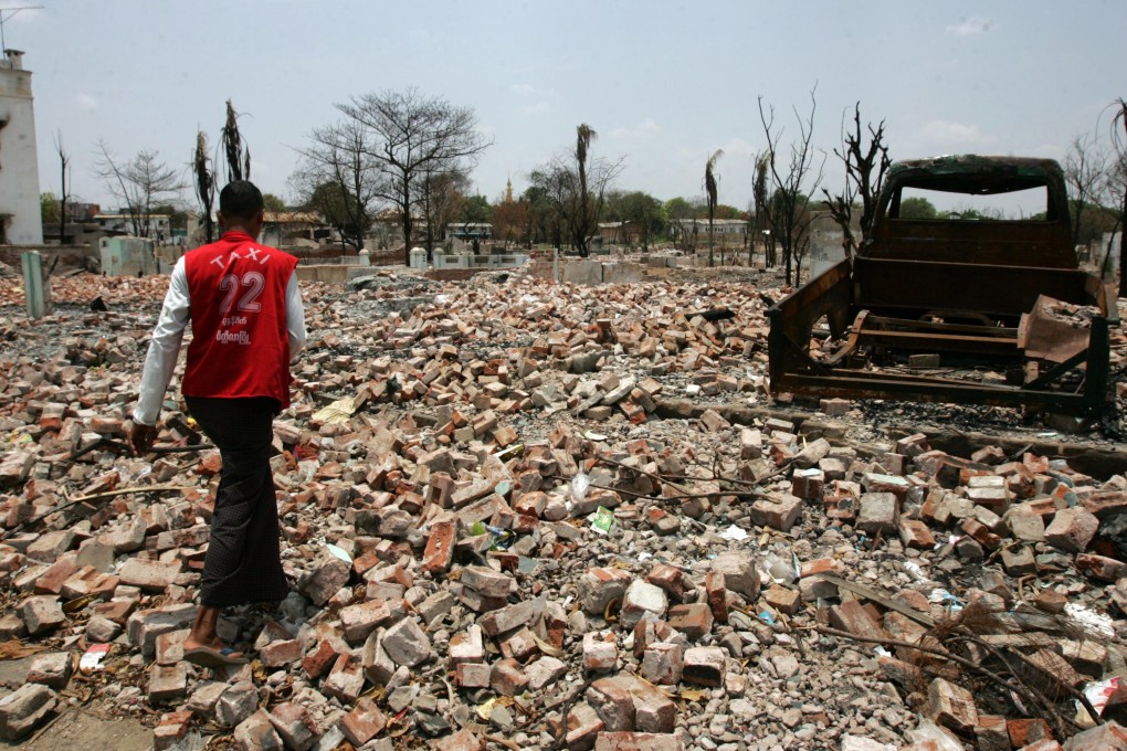 A man walks in a site where a building once stood before sectarian violence between ethnic Rakhine Buddhists and Muslim Rohingya in western Myanmar. Photo: AP