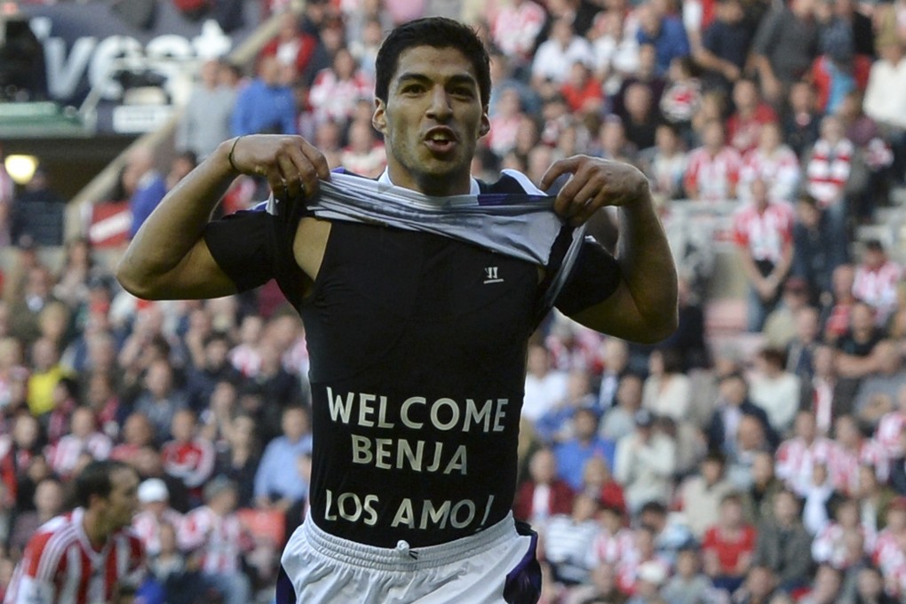 Suarez sends a message of love to his family and new-born son Benjamin after scoring one of his first goals. Photo: Reuters