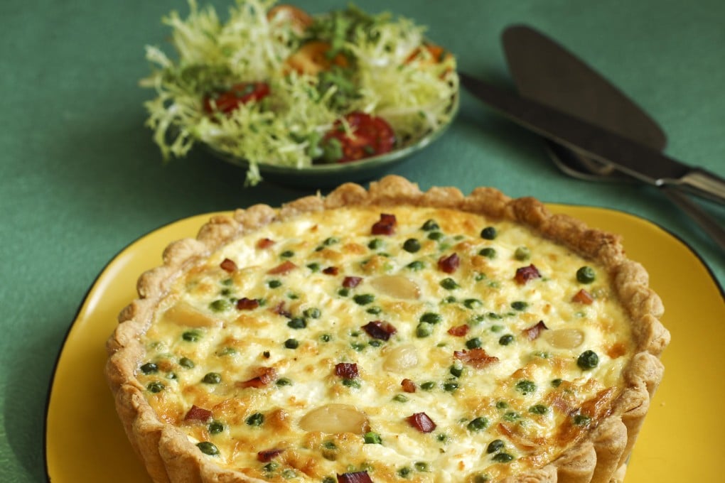 Quiche with pancetta, goat cheese, petits pois and roasted garlic cream