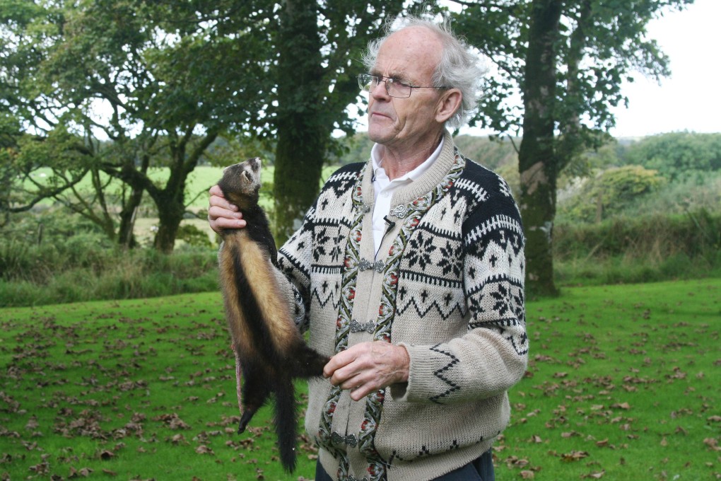 Arthur Boyt poses with a dead polecat at his home in Davidstow in Cornwall, England, on September 10, 2013. Photo: AFP
