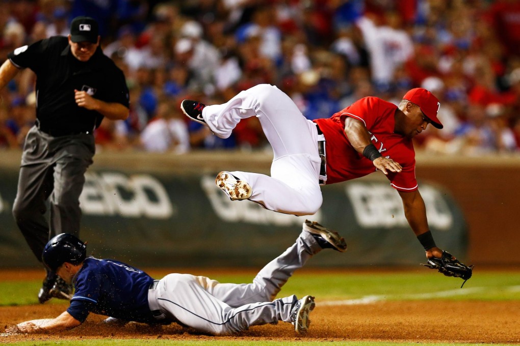 Tampa's Sam Fuld steals third in the ninth inning. Photo: AFP