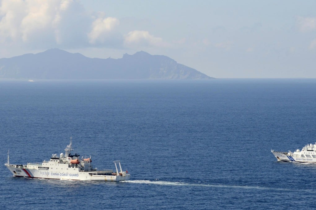 A China coast guard vessel, left, is followed by a Japan coast guard ship near the disputed East China Sea islands. Photo: AP