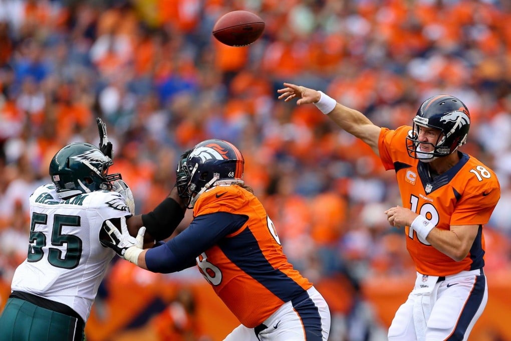Peyton Manning of the Denver Broncos throws a pass in a masterful quarterback display against the Philadelphia Eagles. Photo: AFP