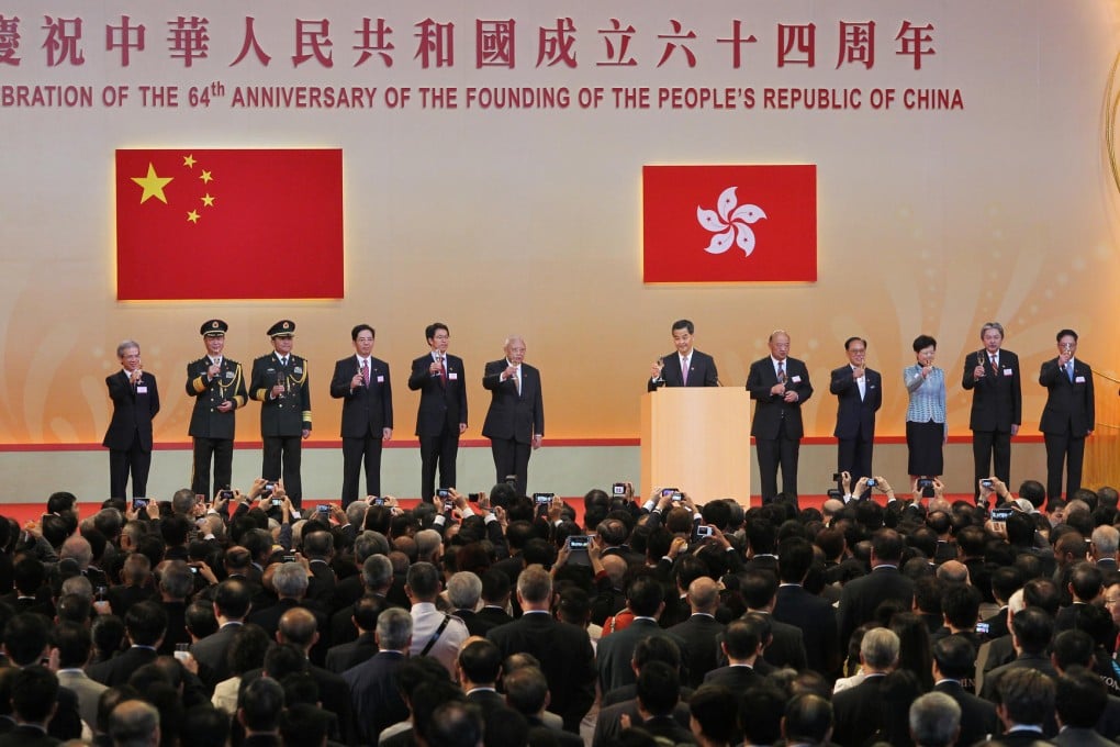 Chief Executive Leung Chun-ying and other senior government officials at the National Day reception yesterday. Photo: Sam Tsang