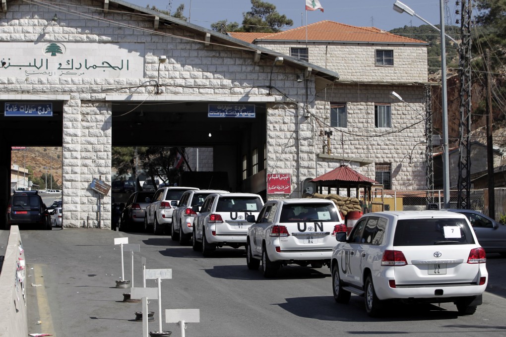 A convoy of UN inspectors cross into Syria at Masnaa, eastern Lebanon. Photo: AP