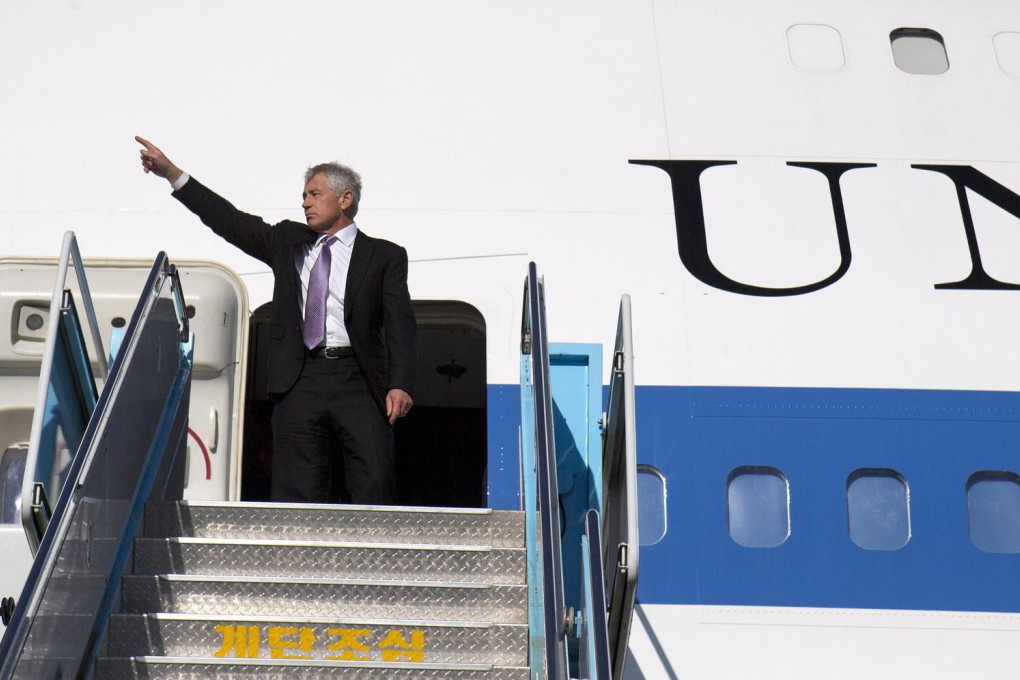 US Defence Secretary Chuck Hagel waves as he boards his plane in Seoul yesterday after talks with his counterpart Kim Kwan-jin. Photo: AP