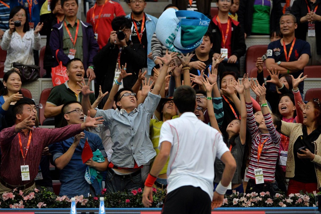 Novak Djokovic endears himself to the mainland fans after winning his first-round match against Czech Lukas Rosol at the China Open in Beijing. Photo: AFP