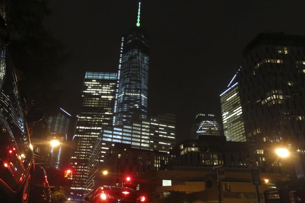 Two daredevils parachuted from a height of about 40 storeys onto a Manhattan street near the World Trade Centre. Photo: Reuters