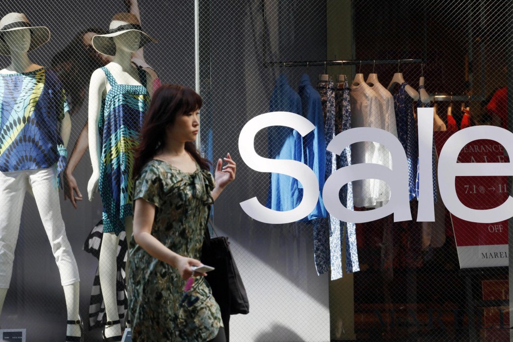 The higher sales tax may deal a blow to consumer demand in Japan just as the world's third-largest economy is picking up. Photo: AP