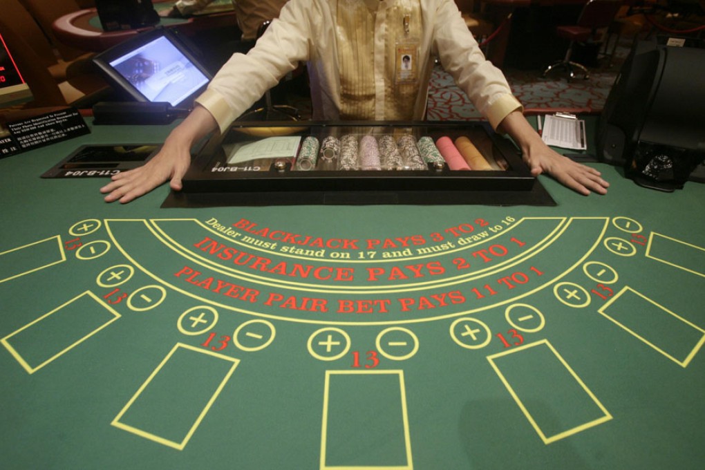 Civil servants must declare within seven days if they have visited the city-state's two casinos more than four times a month. Photo: Reuters