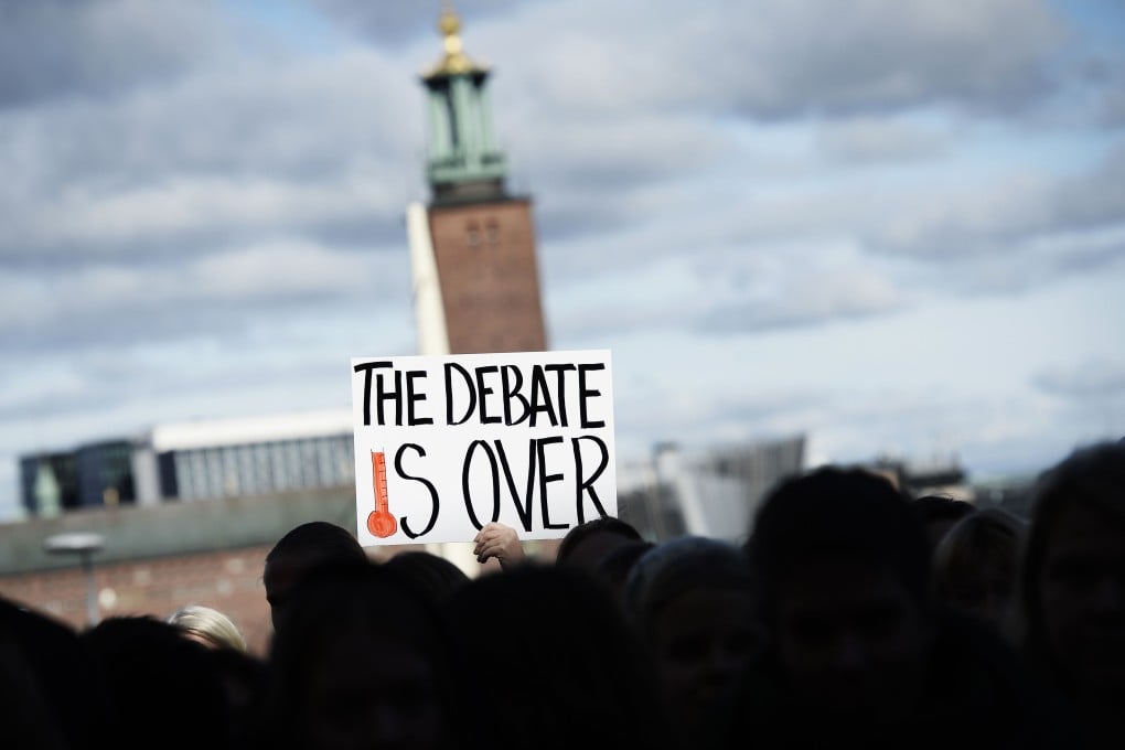 Protesters gather outside the IPCC meeting. Photo: AFP