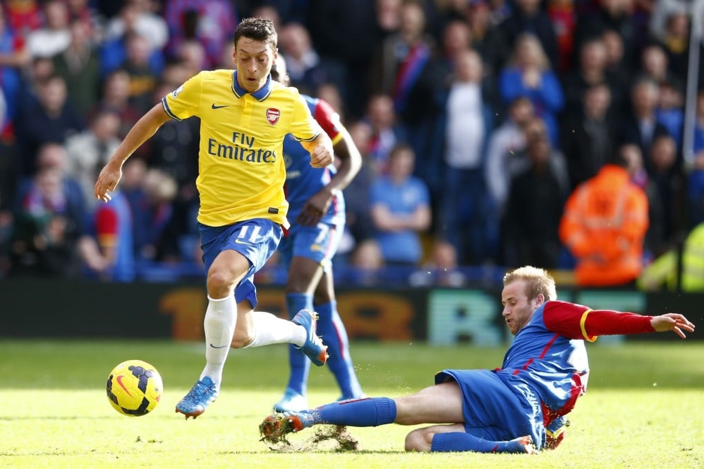 Mesut Ozil eyes the ball during their 2-0 win over Napoli. Photo: AFP