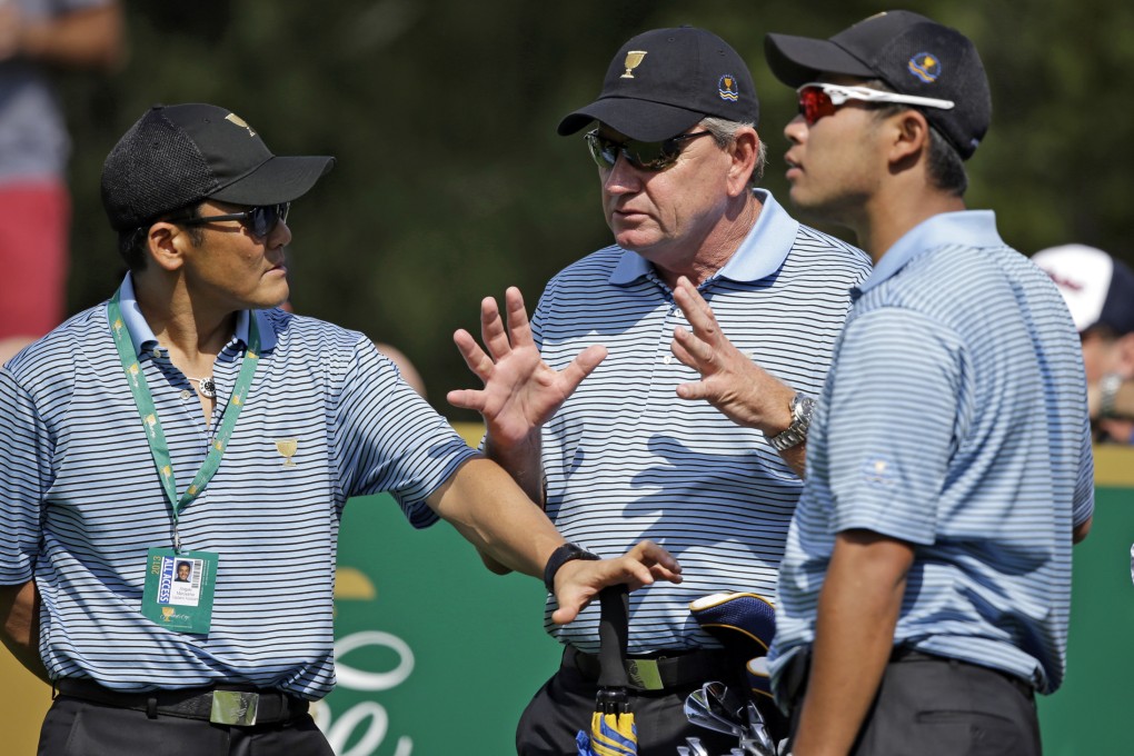 Internationals captain Nick Price talks tactics with Shigeki Maruyama (left) and Hideki Matsuyama, of Japan, during a practice round for the Presidents Cup. Photo: AP