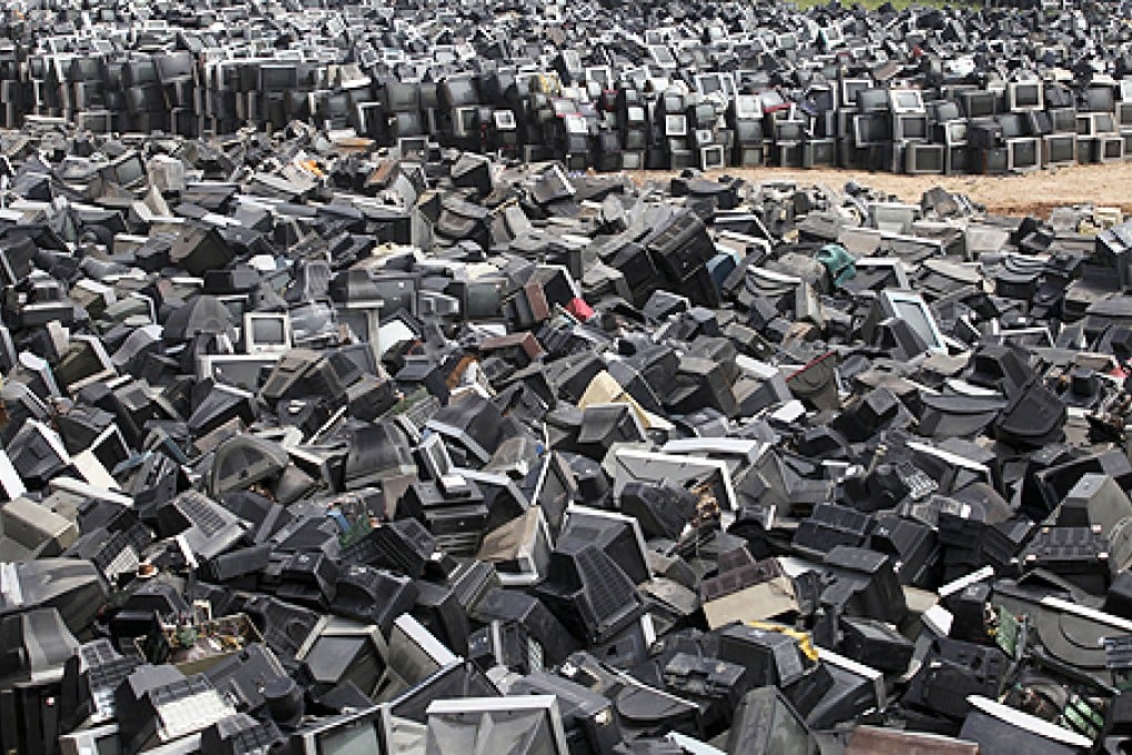 Discarded television sets pile up in a scrap yard awaiting recycling in Zhuzhou city in south China's Hunan province. Photo: AP