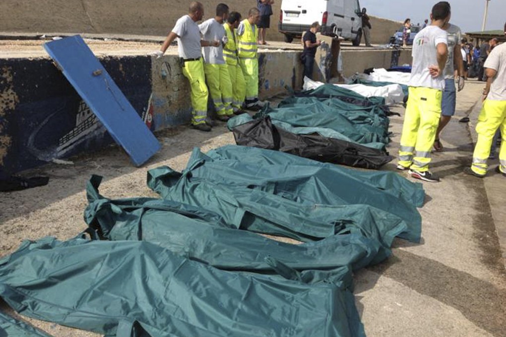 Body bags at the harbour of Lampedusa. Authorities moved them to an airport hangar after the mortuary ran out of space. Photo: Reuters