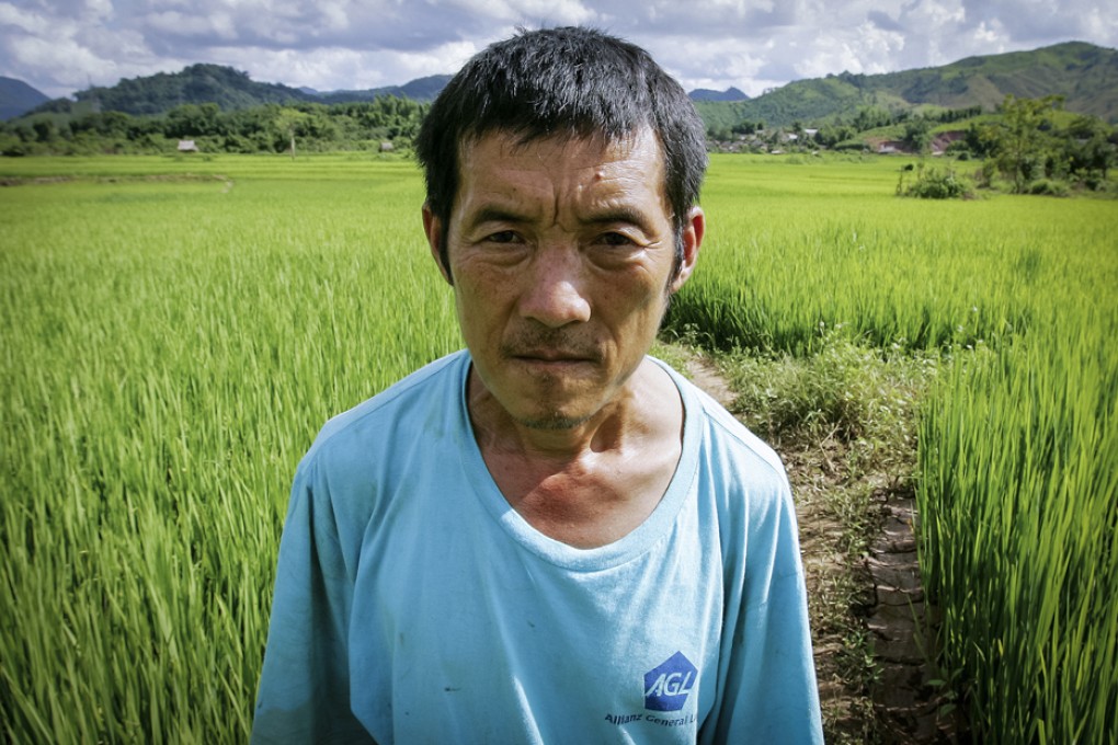 Farmer Galong Vue will lose his home and his village, Naseam Kham, as they are cleared to make way for the railway.