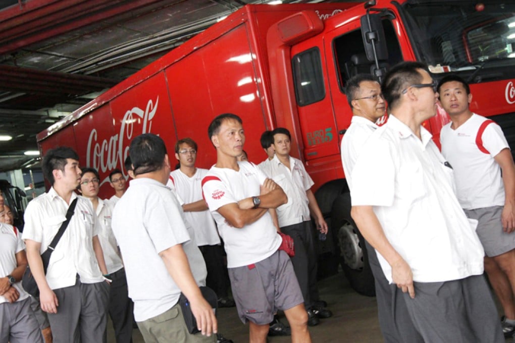 Swire Coca-Cola HK deliverymen stop work over concerns about outsourcing, lower pay and long hours. Photo: David Wong