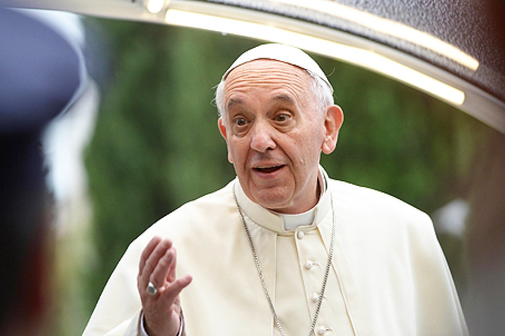 Pope Francis arrives at the St Francis Basilica on Friday. Photo: EPA