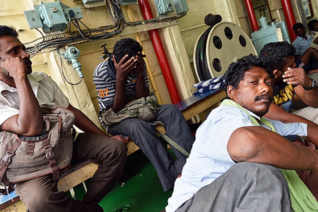 Sri Lankan's rescued from a drifting fishing trawler are brought to a port in Galle on Friday. Photo: AFP