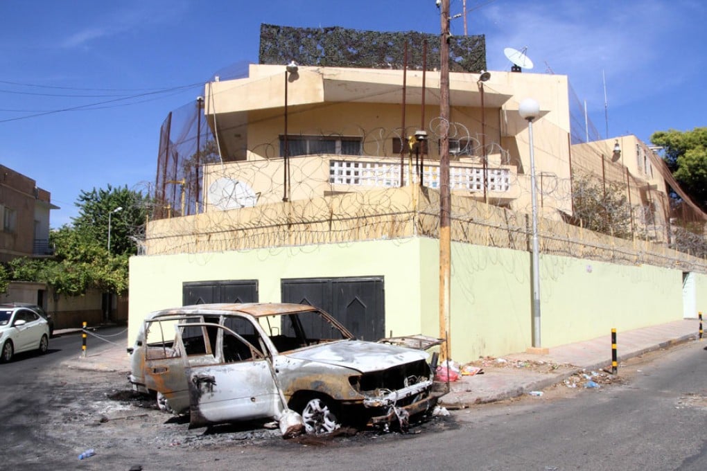 A damaged car is seen in front of the Russian embassy, a day after it came under attack in Tripoli, Libya. Photo: Xinhua
