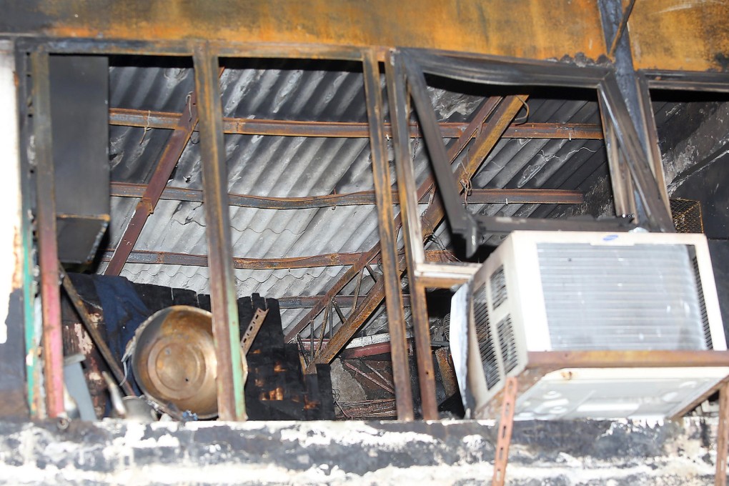 The gutted room where a man burned to death in Cheung Sha Wan early yesterday. Photo: Sam Tsang