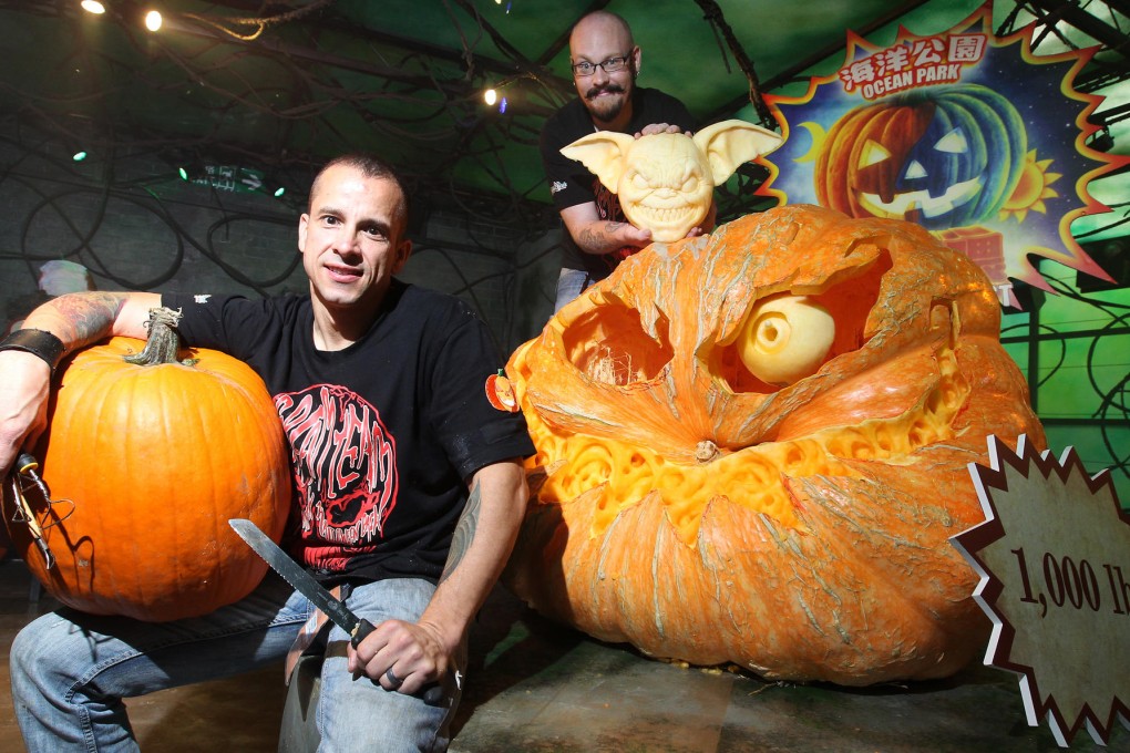 Pumpkin sculptors Andy Bergholtz (left) and Ray Villafane with some of the fruits of their labour. Photo: May Tse