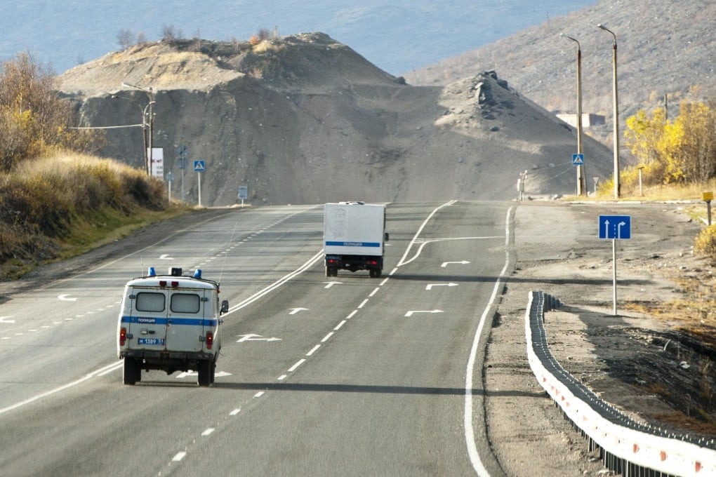 Eight activists travel in a prison van with police escort to Apitity Detention Centre, Murmansk Oblast, where they are charged with piracy. Photo: Greenpeace