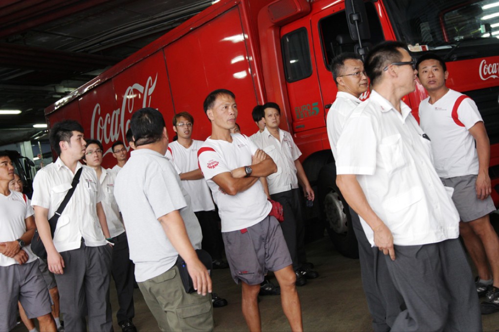 Swire Coca-Cola HK deliverymen stop work over concerns about outsourcing, lower pay and long hours. Photo: David Wong