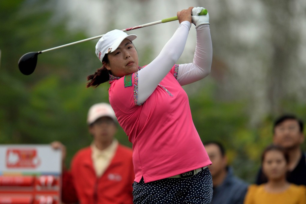 Feng Shanshan of China tees off on the 18th hole during the third day of competition. Photo: AFP