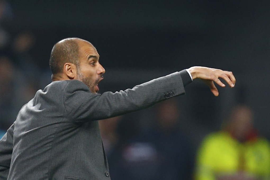 Bayern Munich boss Pep Guardiola urges on his team during their match against Nayer Leverkusen. Photo: Reuters