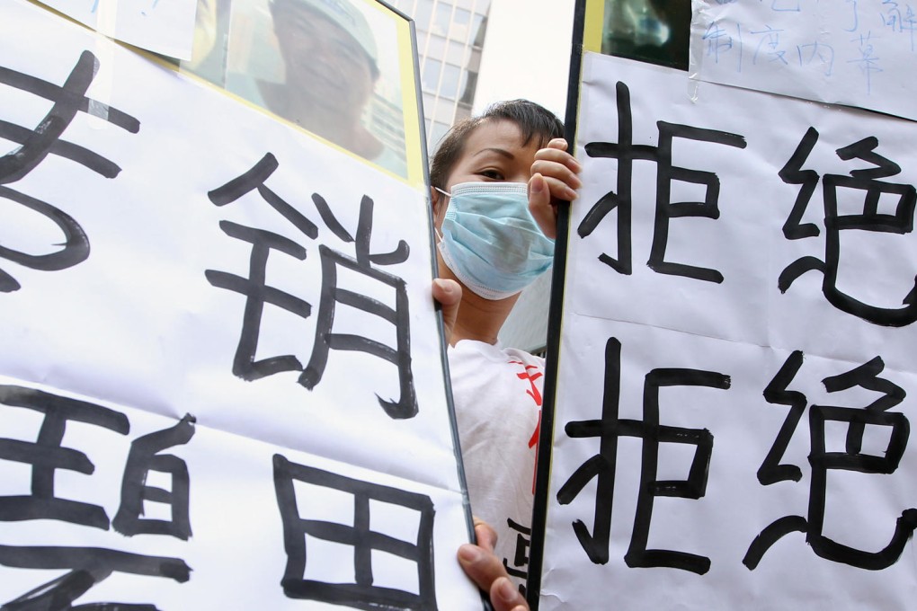Mainland sales agents for DCHL gather outside government headquarters to protest. Photo: Sam Tsang