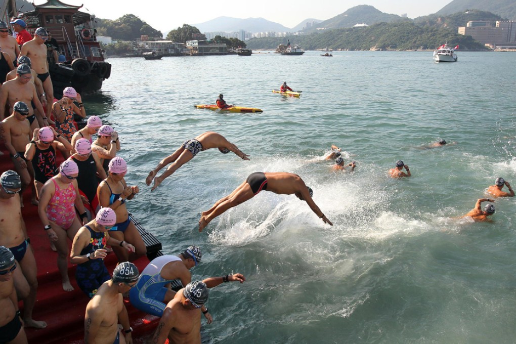 Swimmers take the plunge in the annual cross-harbour race, which was revived in 2011 following its suspension in 1978 over polluted waters. A total of 1,800 swam from Lei Yue Mun to Quarry Bay Park. The Amateur Swimming Association is considering whether to revive the original route from Tsim Sha Tsui to Central by 2015. Photo: Dickson Lee