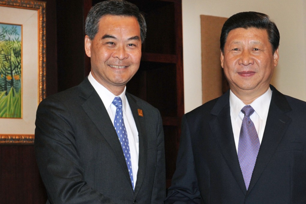 Leung Chun-ying with President Xi Jinping in Bali. Photo: ISD