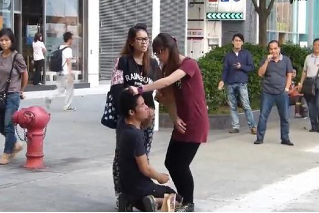 A still from the video shows the girl slapping her boyfriend.