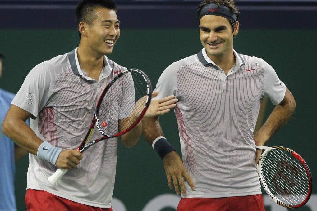 Zhang Ze and Roger Federer are teaming up in the Shanghai Masters. Photo: Xinhua