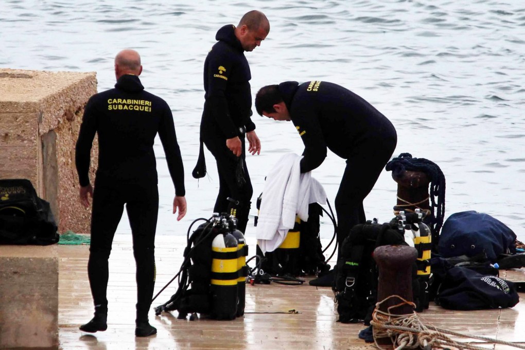 Search and rescue teams at work off Lampedusa. Photo: EPA