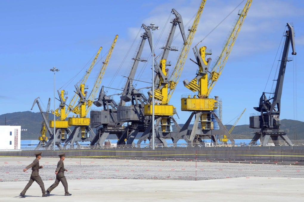 North Korean soldiers march near loading machinery at the port of Rajin. Photo: Reuters
